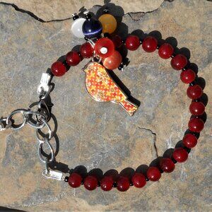 Handmade jewelry set: bracelet and earrings with enameled silver charms